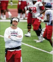  ?? MEGHAN MCCARTHY / THE PALM BEACH POST ?? Head coach Lane Kiffin watches his Florida Atlantic University football team practice earlier thismonth in Fort Lauderdale.