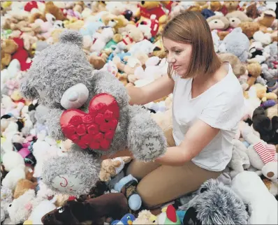  ?? PICTURE: MARK WAUGH/MANCHESTER CITY COUNCIL/PA. ?? TRIBUTES: WI member Judith Suckling with some of the teddy bears which are due to be re-homed.