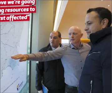  ??  ?? An Taoiseach Leo Varadkar (right) with Minister Paul Kehoe on left and Frank Byrne of the Wexford County Council mapping section in Wexford County Buildings on Sunday.