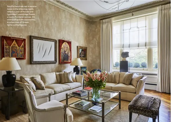  ?? ?? Soulful neutrals set a serene tone in the drawing room, where a pair of fondo oro (gold leaf) paintings flanks a Lucio Fontana canvas. On mirrored panels (opposite), a collection of Greek terra-cotta figures