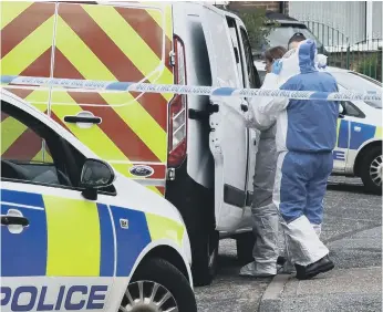  ??  ?? Police in Aintree Road, Sunderland, following the killing. Picture: North News and Pictures