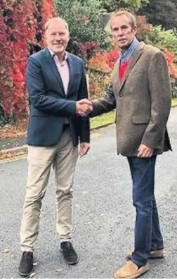  ??  ?? County councillor Keith Rippington, right, shakes hands with Councillor Paul Hodgkinson