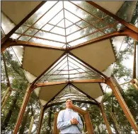  ?? (Los Angeles Times/TNS/Genaro Molina) ?? The Rev. David Brown stands inside the Wayfarers Chapel in Rancho Palos Verdes. He has launched an appeal on GoFundMe to try to raise money that can be used to stabilize the chapel, which sits on an accelerati­ng landslide complex.