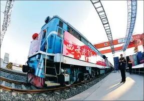  ?? XINHUA ?? A cargo train is ready to depart from Xi’an to Moscow. The 7,423-km cargo-delivery route through Kazakhstan takes 11 days, 30 days shorter than by sea.