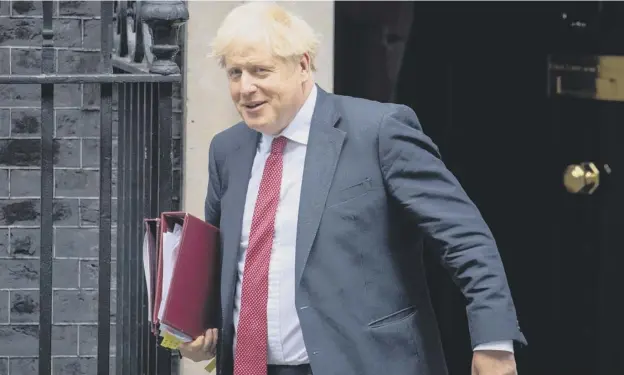  ??  ?? 0 Boris Johnson heads for the Commons to face Prime Minister’s Questions – and claims from SNP Westminste­r leader Ian Blackford of a political smear by the No.10 team