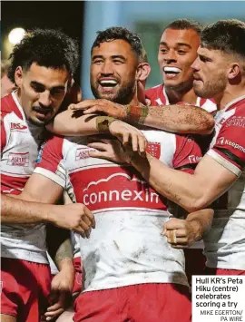  ?? MIKE EGERTON/ PA WIRE ?? Hull KR’S Peta Hiku (centre) celebrates scoring a try