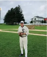  ?? Courtesy of Nancy Saunders ?? Frank Dardis, one of the Ghost Players who emerged from the cornfield in “Field of Dreams,” wears his 1918 Chicago White Sox uniform at the movie site.