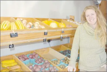  ?? (NWA Democrat-Gazette/Rachel Dickerson) ?? Melissa Millsap of Turnbuckle Farm on Northwest McNelly Road is pictured at her farm stand offered to the public with produce and locally made goods.