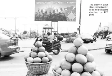  ??  ?? This picture in Dakar, shows electoral posters on the eve of legislativ­e elections. — AFP photo