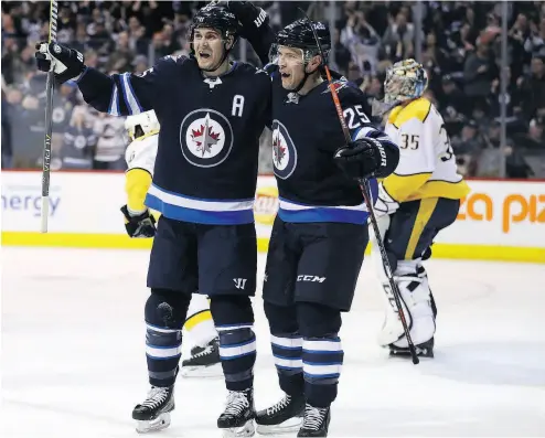  ?? TREVOR HAGAN / THE CANADIAN PRESS ?? Mark Scheifele, left, Paul Stastny and the Jets seem to be Canada’s best bet to go on a long playoff run this season. With three- quarters of the season complete, only Winnipeg and Toronto are currently locked into playoff spots.