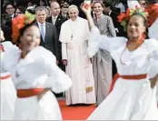  ?? ANDREW MEDICHINI/AP ?? Pope Francis watches dancers alongside first lady Maria Clemencia Rodriguez and President Juan Manuel Santos.