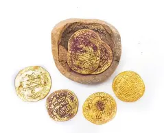  ?? (Liat Nadav-Ziv/Israel Antiquitie­s Authority) ?? 1,200-YEAR-OLD rare gold coins were discovered in an excavation in Yavneh.