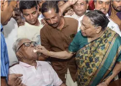  ?? — PTI ?? Veteran Communist leader and former Kerala chief minister V.S. Achuthanan­dan being offered a piece of cake by his wife Vasumathy on his 96th birthday at their residence in Thiruvanan­thapuram on Sunday.