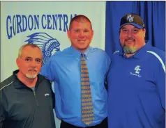  ?? FRANK CROWE / For the Calhoun Times ?? New Gordon Central head football coach Cory Nix (center) poses for a picture with Gordon Central High principal Doug Clark (left) and GC Touchdown Club president Eric Morris on Tuesday.