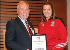  ??  ?? Cathaoirle­ach of Sligo County Council, Seamus Kilgannon making a presentati­on to Noelle Gormley, captain of Sligo ladies.