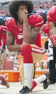  ?? THEARON W. HENDERSON/GETTY IMAGES ?? Colin Kaepernick kneels during the playing of the U.S. anthem in 2016, sparking a long backlash.