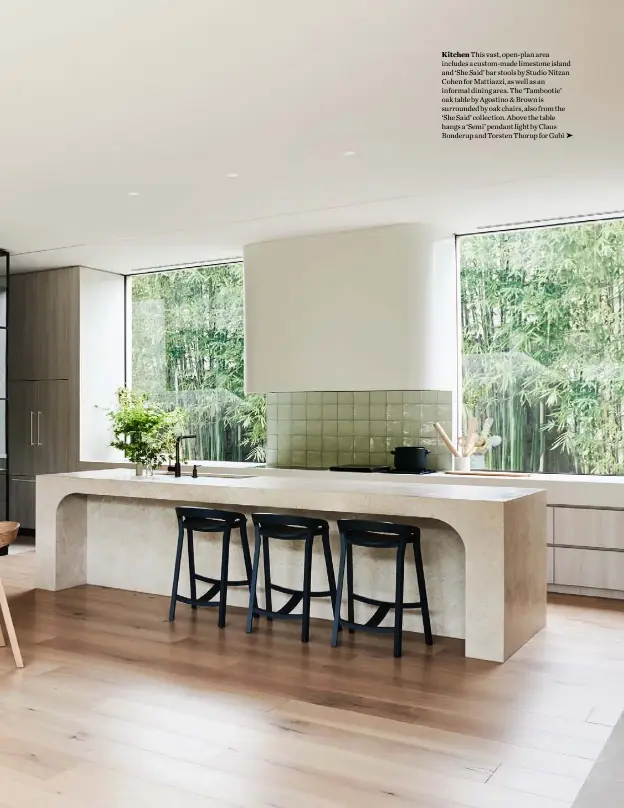  ??  ?? Kitchen This vast, open-plan area includes a custom-made limestone island and ‘She Said’ bar stools by Studio Nitzan Cohen for Mattiazzi, as well as an informal dining area. The ‘Tambootie’ oak table by Agostino & Brown is surrounded by oak chairs, also from the ‘She Said’ collection. Above the table hangs a ‘Semi’ pendant light by Claus Bonderup and Torsten Thorup for Gubi