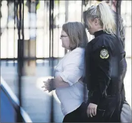  ?? CP PHOTO ?? Elizabeth Wettlaufer enters the provincial courthouse in Woodstock, Ont.