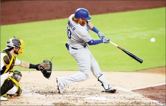  ?? (AP) ?? Los Angeles Dodgers’ Justin Turner singles to right center against the San Diego Padres in the third inning of a baseball game on Sept 15 in San Diego.