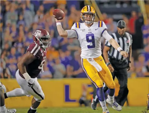  ?? AP ?? LSU’s Joe Burrow, who won the Heisman Trophy after throwing 48 touchdown passes this season, likely will be the top quarterbac­k taken in the 2020 NFL Draft.