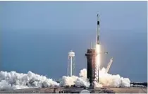  ?? JOHN RAOUX/AP ?? A Falcon 9 SpaceX rocket lifts off from pad 39A during a test flight Sunday to demonstrat­e the capsule’s emergency escape system at the Kennedy Space Center in Cape Canaveral.