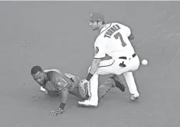  ?? GETTY IMAGES ?? The Diamondbac­ks’ Jarrod Dyson slides safely past the Nationals’ Trea Turner for a double to lead off the game at Nationals Park on Thursday night.