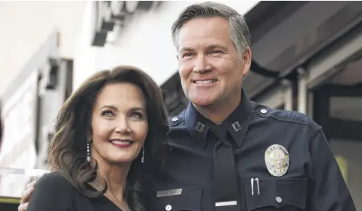  ?? CHRIS PIZZELLO/AP ?? Los Angeles Police Department Captain Cory Palka with actor Lynda Carter during her 2018 Walk of Fame ceremony.