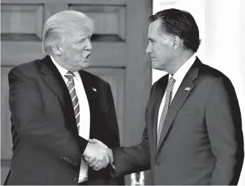  ?? Associated Press ?? ■ In this Nov. 19, 2016, file photo, then-President-elect Donald Trump and Mitt Romney shake hands as Romney leaves Trump National Golf Club Bedminster in Bedminster, N.J.