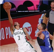  ?? GETTY IMAGES ?? BUCKET: George Hill drives for two during the Bucks series-clinching win over Orlando yesterday.