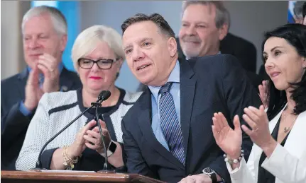  ?? JACQUES BOISSINOT/THE CANADIAN PRESS FILES ?? Coalition Avenir Québec Leader François Legault, centre, believes the Couillard government’s handling of the asylum-seeker file may help his party in the upcoming byelection in the Quebec City riding of Louis-Hébert because voter discontent is high.