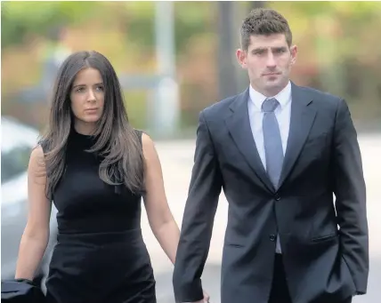  ??  ?? > Footballer Ched Evans with fiancée Natasha Massey outside court yesterday. Evans denies rape