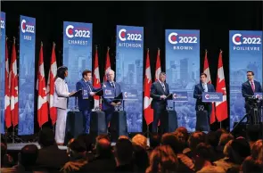  ?? The Associated Press ?? Leslyn Lewis, left, Roman Baber, Jean Charest, Scott Aitchison, Patrick Brown, and Pierre Poilievre debate at the Conservati­ve Party’s leadership debate in Edmonton, Wednesday.