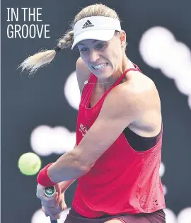  ?? Picture: AFP ?? Angelique Kerber of Germany hits a return against Dominika Cibulkova of Slovakia in the quarterfin­als at the Sydney Internatio­nal yesterday. Kerber won 6-3, 6-1.