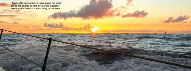  ??  ?? Plenty of breeze and sea room make for ideal schooner-sailing conditions as the sun goes down at the close of the first day of the race