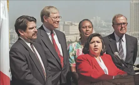  ?? Bob Chamberlin Los Angeles Times ?? GLORIA MOLINA, at lectern, and other L.A. County supervisor­s in 1995. She represente­d the 1st District on the board from 1991 to 2014.