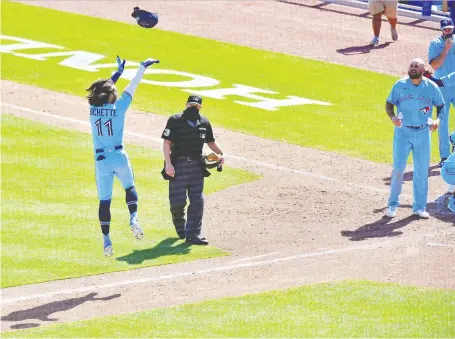  ?? JULIO AGUILAR/GETTY IMAGES ?? Bo Bichette tosses his helmet after hitting a walk-off homer in the ninth inning to give the Blue Jays a 5-4 win over the New York Yankees at TD Ballpark in Dunedin, Fla., on Wednesday. It was the second homer of the game for Bichette, who has an 11-game hitting streak.