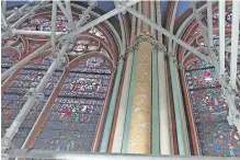  ?? MATHILDE BELLENGER AFP ?? THIS video grab from an AFP video taken on April 11 shows restored stained-glass windows and pillars inside the Notre Dame Cathedral. It is scheduled to reopen in December. |