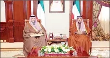  ?? KUNA photos ?? HH the Crown Prince receives Minister Anas Al-Saleh.