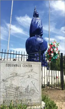  ?? PHOTOS BY PETE BANNAN - MEDIANEWS GROUP ?? The statue of Christophe­r Columbus in Chester has been covered by a tarp.