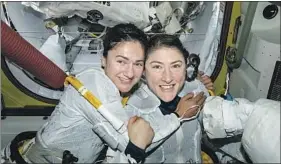  ?? NASA ?? U.S. ASTRONAUTS Jessica Meir, left, and Christina Koch inside the Internatio­nal Space Station in October. The two took part in the first all-female spacewalk.