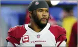  ?? MARCIO JOSE SANCHEZ — THE ASSOCIATED PRESS FILE ?? Arizona quarterbac­k Kyler Murray warms up before a playoff game against the Rams in Inglewood, Calif., last January.