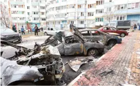  ?? PHOTO: STRINGER/AFP ?? Burned-out cars are seen in a residentia­l area of the city of Belgorod following fresh aerial attacks yesterday.