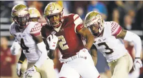  ?? Michael Dwyer / Associated Press ?? Boston College running back A.J. Dillon, from New London, carries against Florida St.