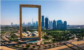  ?? Photograph: Aleksandar Tomic/Alamy ?? The Dubai skyline seen through the giant Dubai Frame building. The city-state is hosting the UN’s Cop28 climate conference.