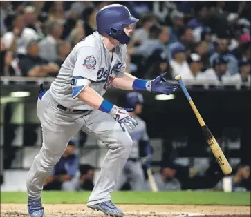  ?? Denis Poroy Getty Images ?? JOC PEDERSON doubles in the sixth inning at San Diego. Pederson went two for three with one RBI.