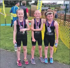  ??  ?? Rhea Webster, Ruby Wright and Caylyn Millar with their medals.