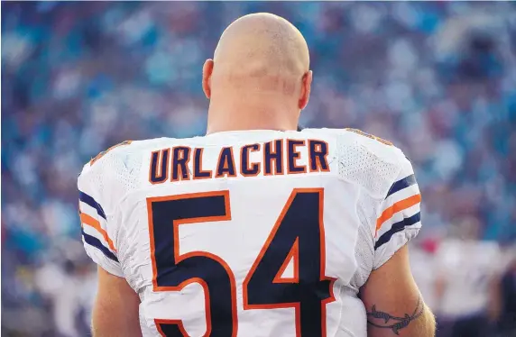  ?? AP FILE ?? Former UNM and Chicago Bears linebacker Brian Urlacher, who will be inducted into the Pro Football Hall of Fame today, was a master at the solo tackle.