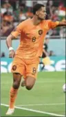  ?? (AFP) ?? Netherland­s’ forward Cody Gakpo rejoices after scoring the opening goal at the Al Thumama Stadium in Doha on Monday.