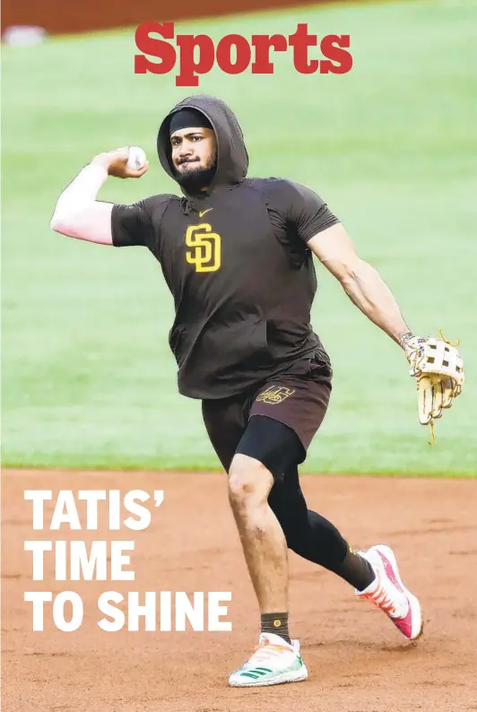  ?? K.C. ALFRED U-T ?? Fernando Tatis Jr., fielding a grounder during practice at Globe Life Field for the NLDS on Monday, says, “Real players make real history in the postseason.”