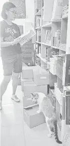  ??  ?? Every bookshop has a cat?